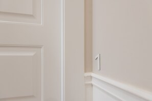 A white door with a number '1' indicating a room number. - Five Boutique Rooms - Camera 1 (Naples)