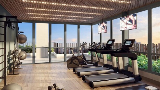 A modern gym with treadmills, elliptical machines, and free weights. - Studio Completo - Aclimação (São Paulo)