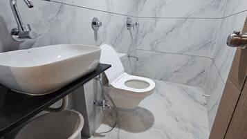 Deluxe Double Room, City View | Bathroom | Shower, free toiletries, slippers, towels