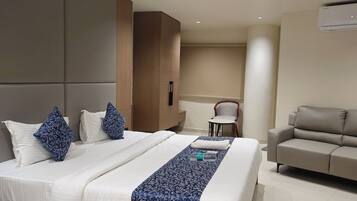 Deluxe Double Room, City View | In-room safe, desk, laptop workspace, iron/ironing board