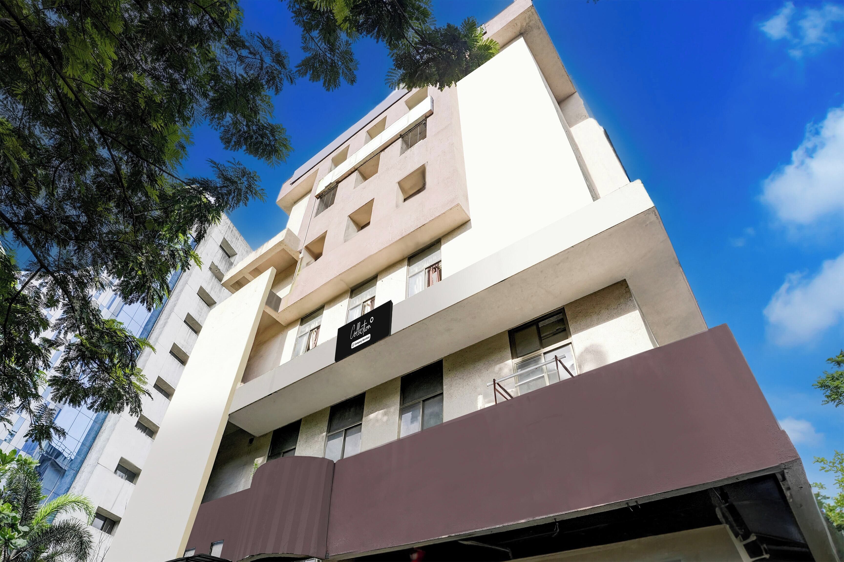 A multi-story building with a sign that reads 'Collection.'