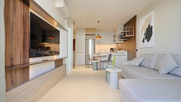 Suite, Balcony, Pool View | Living area