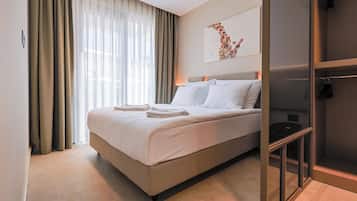 Suite, Balcony, Pool View | In-room safe, iron/ironing board, free WiFi