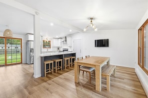 Dining - Renovated split-level with killer Lambeau Field views. Super short walk to games & Titletown District. Fully fenced yard. 3 bedrooms + bath upstairs, kitchen/dining main, living room lower, bedroom + bath lowest level. Perfect game-day base! (Green Bay)