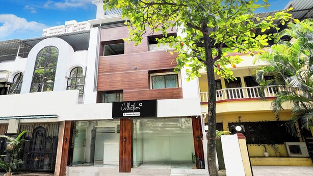 A multi-story building with a storefront labeled 'Collection.' - Collection O Goregaon Near Film City (Mumbai)