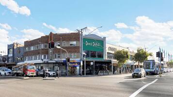 A street view with a building labeled 'Dine & Dine' and a visible 'EZyMart' store.