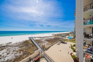 A beachfront hotel with a pool, beach access, and a view of the ocean. - Phoenix Iii 3036 2 Bedroom Condo (Orange Beach)