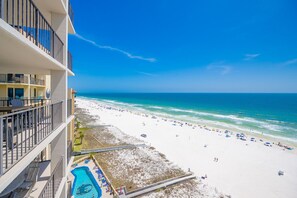A beachfront hotel with a pool, beach, and ocean view. - Phoenix Iii 3128 2 Bedroom Condo (Orange Beach)