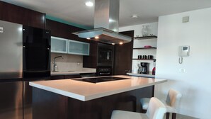 Coffee/tea maker, fridge, microwave, oven