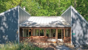 A cabin with a covered porch, a chimney, and a number sign indicating its location. - Whimsical Cabin: Secret Room, Pizza & HOT TUB (Basye)