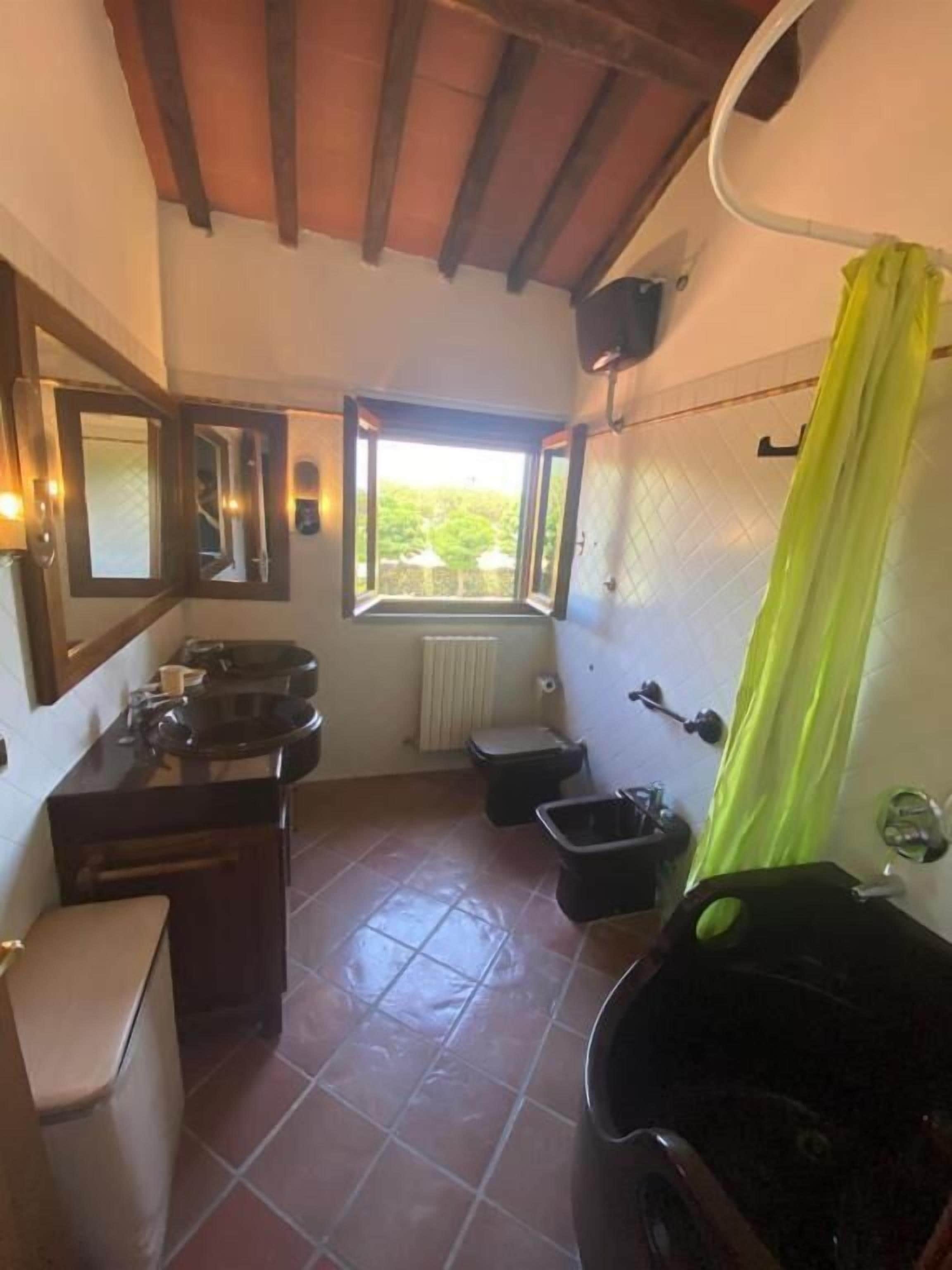 Appartamento Attico, vista giardino | Baño