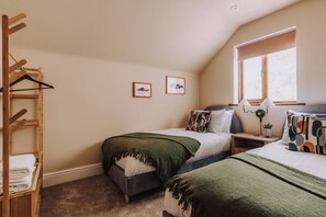 A bedroom with two beds, a wooden ladder, and a window. - The Damson Loft, Cosy, Central Bowness, Parking (Bowness-on-Windermere)