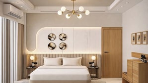 Ein modernes Schlafzimmer mit einem großen Bett, Nachttischlampen, einer Wandleuchte und einem Holzschrank.
