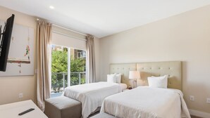 A hotel room with two beds, a TV, a desk, and a window with curtains. - Stylish 4 Ensuite Home Near Disney, Free BBQ Grill (Kissimmee)