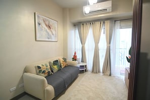 Comfort Condo, 1 Bedroom, Non Smoking, Air conditioning | Living room | 32-inch Smart TV with digital channels - Kuya Awens Staycation Unit14C (Parañaque)
