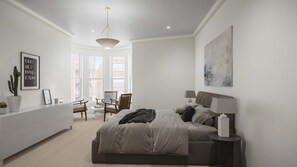 Ein Schlafzimmer mit Bett, Nachttischen, Schreibtisch, Stühlen und einem Fenster.