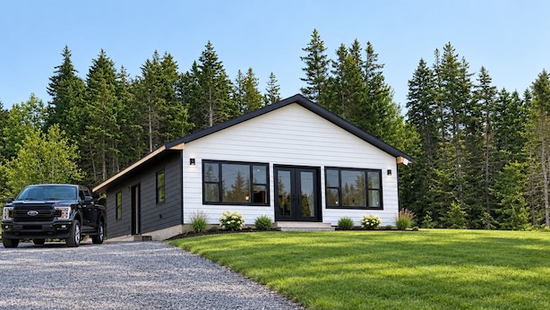A modern two-story house with a gravel driveway and a well-maintained lawn. - NOW BOOKING FOR 2027!! (Irish Cove)