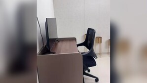 A modern office space with a desk, chair, and a laptop. - lavender residense MIDC andheri east (Mumbai)