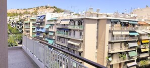 A residential area with multi-story buildings, balconies, and satellite dishes. - Sunny home in Acropolis (Athens)