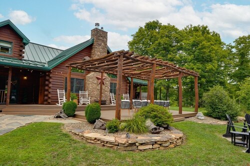 Triple Trac Lodge, upscale retreat in the countryside with 7 Bedrooms, hot tub, game room, and so much more. Plenty of fun for everyone!