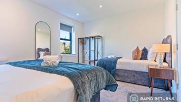 3 bedrooms, desk, iron/ironing board, travel cot