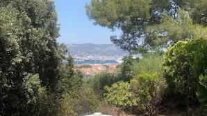 A table set outdoors with a view of a cityscape in the background.