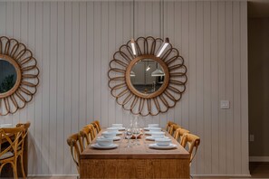 A dining room with a wooden table set for six, surrounded by wooden chairs. - Go 37 - Windsor Island (Davenport)