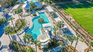 An aerial view of a resort with multiple swimming pools, palm trees, and lounge areas. - 2 Blocks to Beach | Screened-in Porch (Santa Rosa Beach)