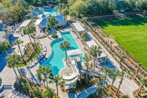 An aerial view of a resort with multiple swimming pools, palm trees, and lounge areas. - 2 Blocks to Beach | Screened-in Porch (Santa Rosa Beach)