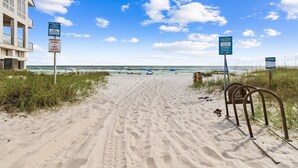 A sandy beach path leading to the ocean with beachgoers and beach chairs. - Marimac's Maison|Private Pool|Elevator|Golf Cart (Inlet Beach)
