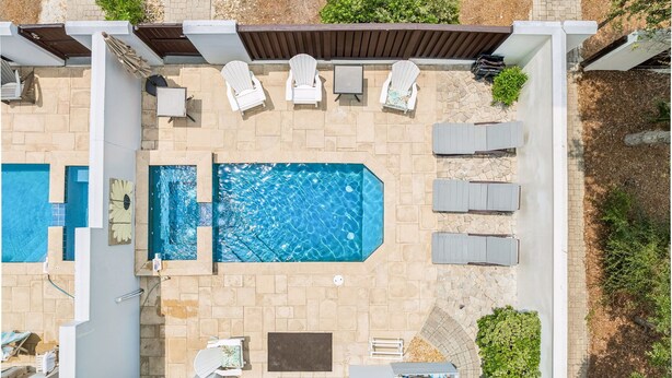 A rooftop pool area with a rectangular pool, lounge chairs, and a pergola. - Marimac's Maison|Private Pool|Elevator|Golf Cart (Inlet Beach)