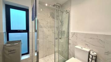 Shower, towels, toilet paper