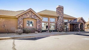 A building with a stone facade, large windows, and a flat roof. - Spacious townhome with shared pool & hot tub (Washington)