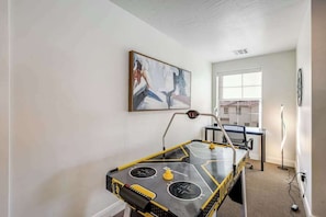 A room with a pool table, a painting on the wall, and a window. - Brand New 5BR Zion National Park - Patio (Washington)