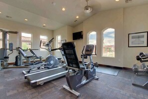 A gym with treadmills, elliptical machines, and free weights. - 3BR Mountainview Paradise Village - Pool (Santa Clara)