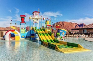 A water park with multiple slides and a pool area. - Spacious 5BR Mountainview Paradise Village (Santa Clara)