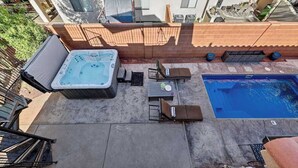 A backyard with a hot tub, a pool, and outdoor furniture. - 5BR home with waterpark, private pool and spa (Santa Clara)