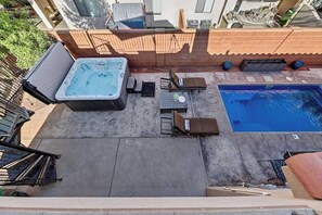A backyard with a hot tub, a pool, and outdoor furniture. - 5BR home with waterpark, private pool and spa (Santa Clara)