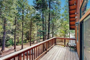 A wooden deck with a railing overlooking a forested area. - The Rockin' Buffalo - Granite Ridge (Shaver Lake)