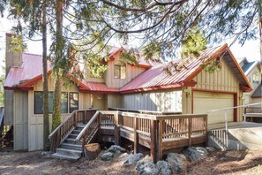 A two-story wooden cabin with a metal roof, a wooden staircase, and a front porch. - Forest With A View - Musick Falls (Shaver Lake)