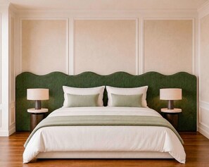 A neatly made bed with a green headboard, two bedside lamps, and a light-colored wall with paneling. - Villa with jacuzzi & heatable pool in Olhão (Olhão)