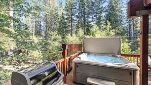 A deck with a Weber grill and a hot tub. - Heavenly Daze - Meadowmont (Arnold)