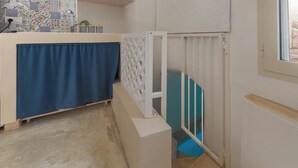 A bathroom with a shower area, a towel rack, and a tiled wall. - AquaTerrae by BarbarHouse (Alezio)