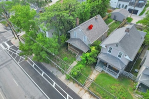 A residential area with houses, a street, and a sidewalk. - 1918 Charm Meets Modern  OSU-Close Gem (Columbus)