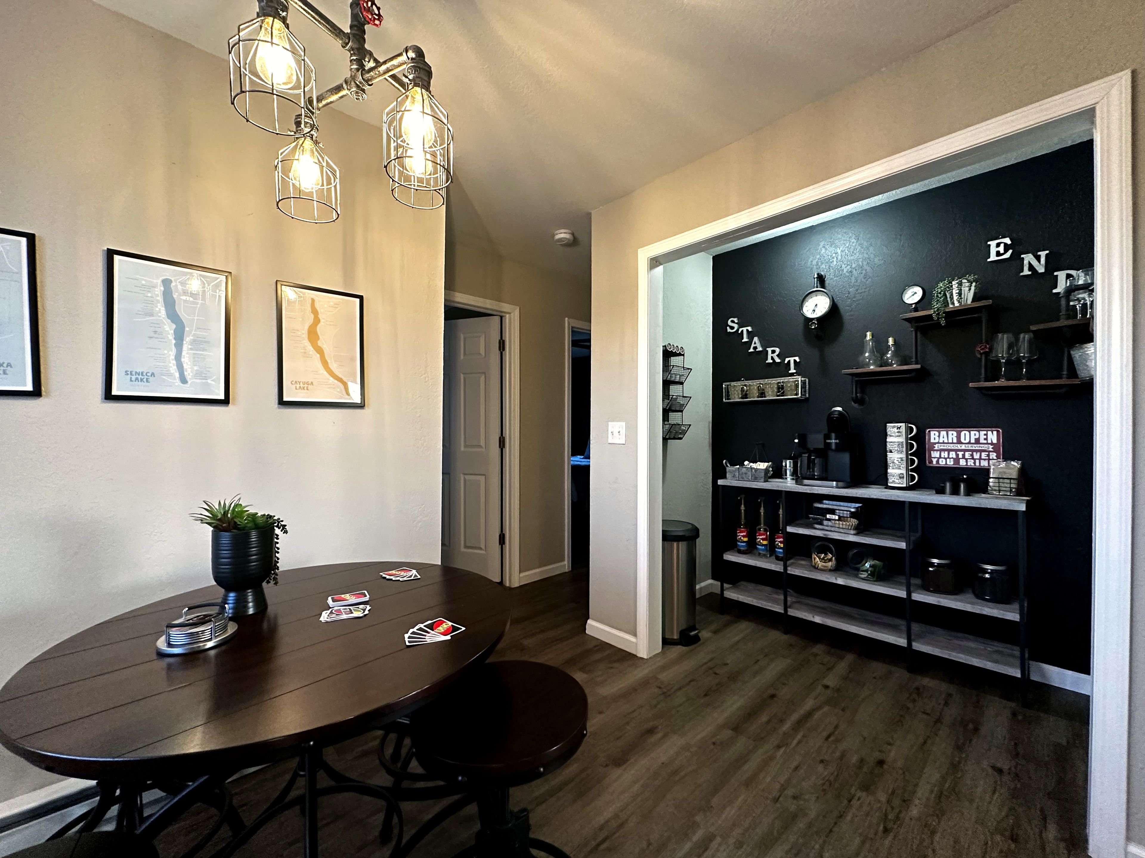 Cozy dining nook with industrial lighting and a fun built-in bar area
