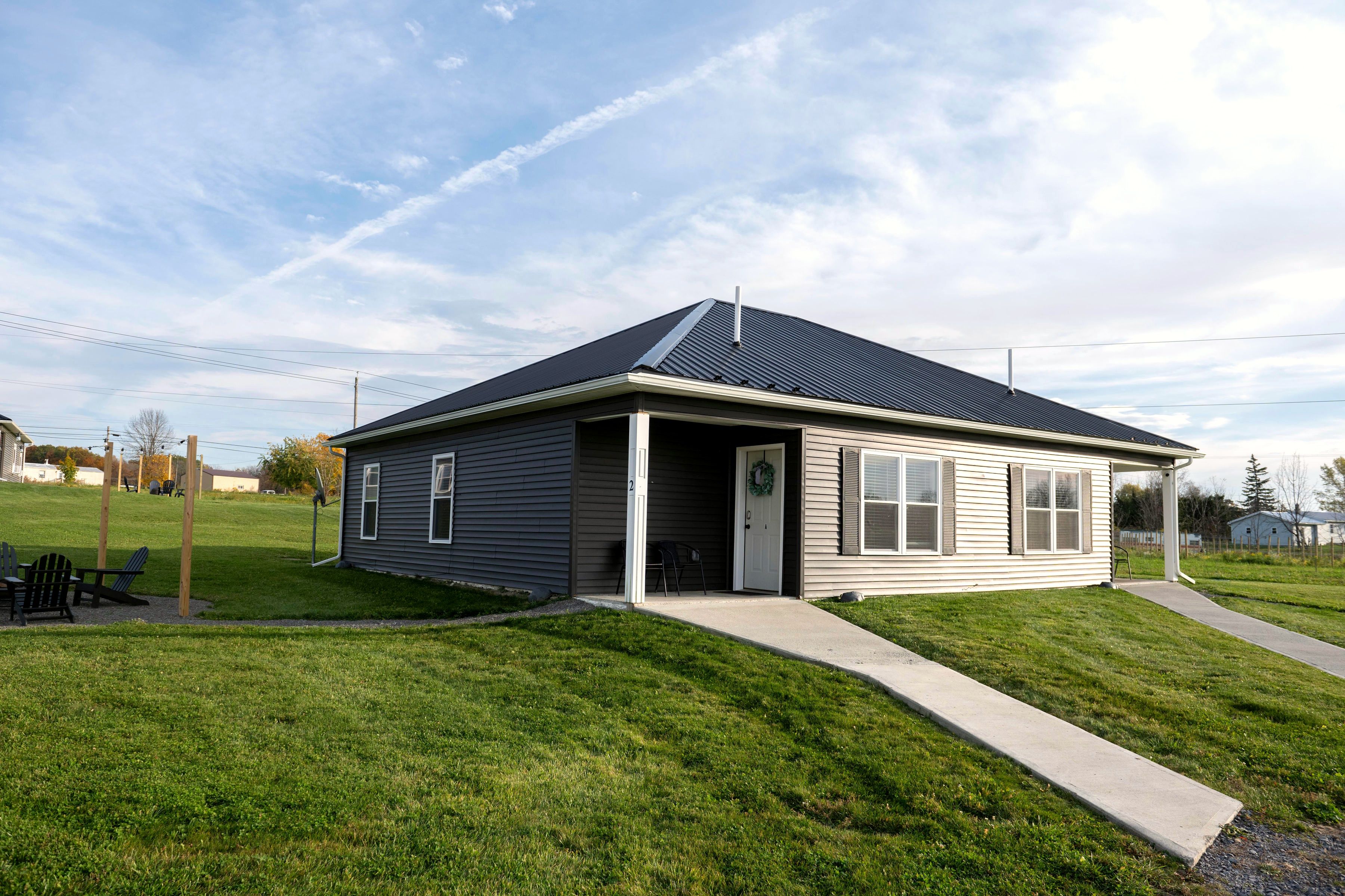 Modern single-story home with spacious yard and inviting covered entry