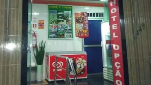 A hotel entrance with a sign reading 'HOTEL OPCÃO' and a phone number '3232-7783'. - Hotel Opção (Manaus)