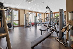 A gym with various exercise equipment, large windows, and a clean floor. - First Tracks at Wildhorse | Gondola + Hot Tubs (Steamboat Springs)