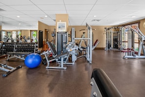 A gym with various exercise equipment, a blue exercise ball, and treadmills. - First Tracks at Wildhorse | Gondola + Hot Tubs (Steamboat Springs)