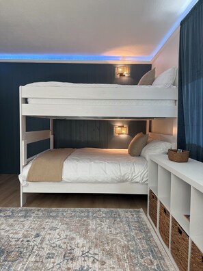 A bunk bed with a headboard, bedside table, and storage compartments. - Updated Home! Minutes to Old Town&ASU Heated Pool Hot Tub Game Room Mini Golf! (Tempe)